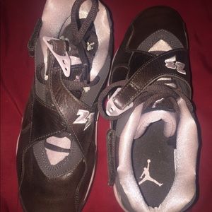 Brown and pink Jordan sneakers.